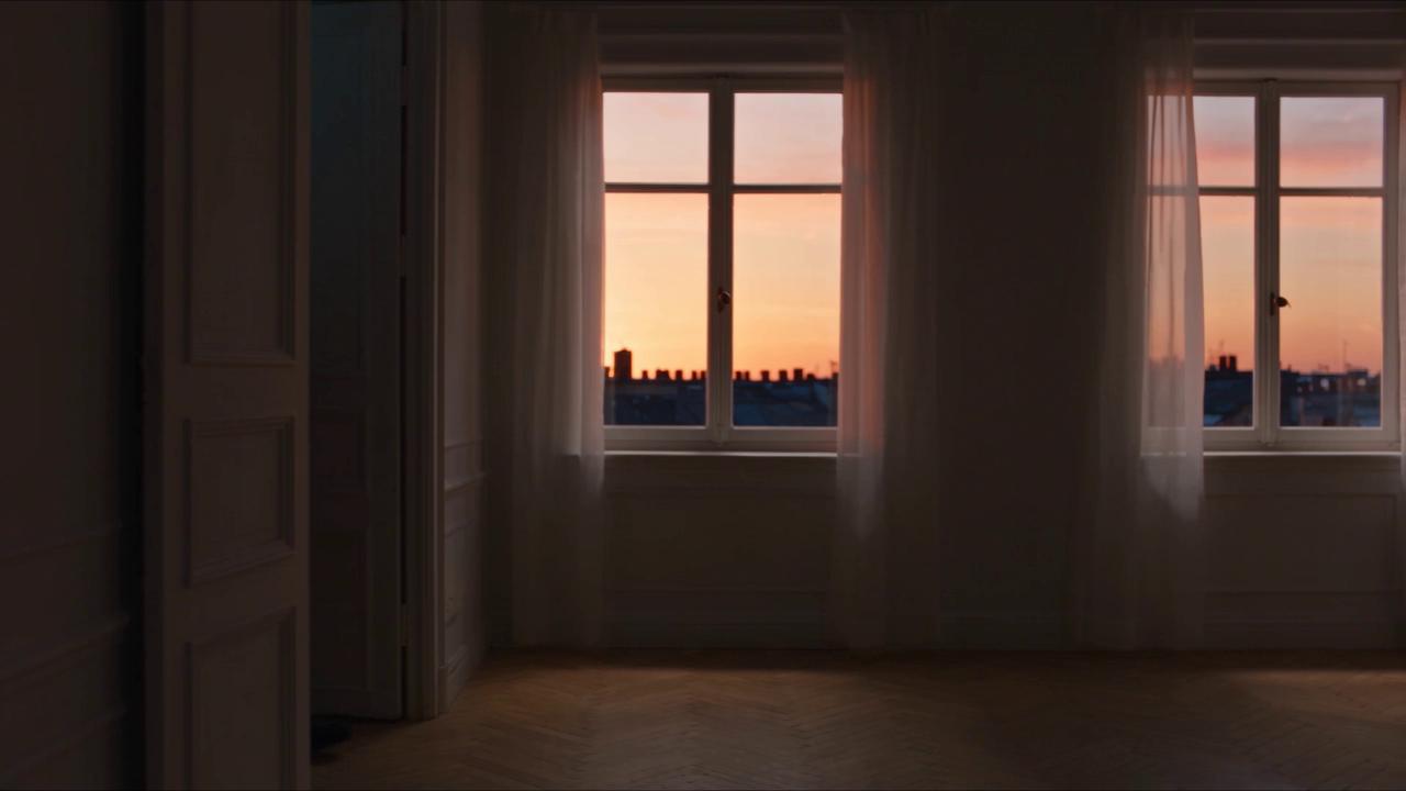 One continuous shot — the camera steadily follows a person wearing a bl…