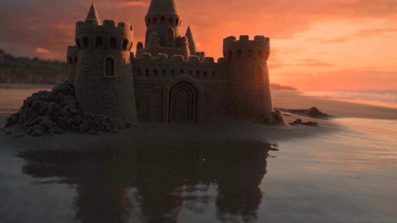 Take @video1 (first 10s: waves surging toward a delicate sandcastle, cl…