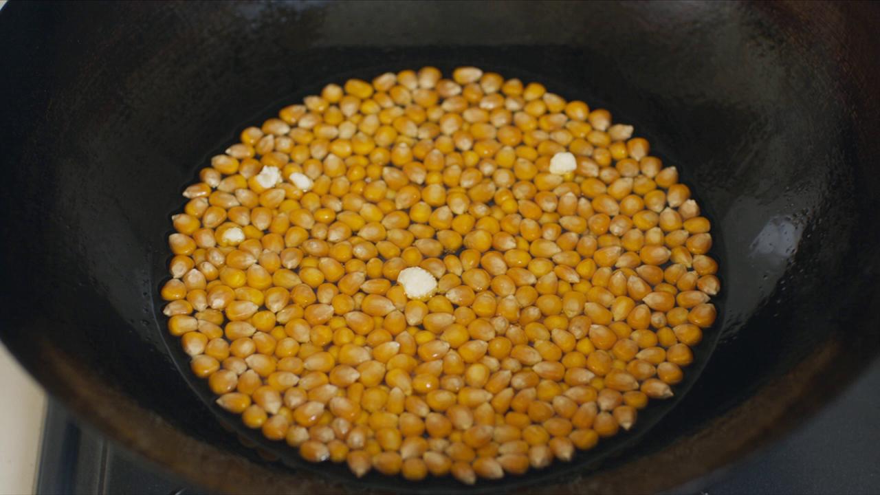 Take @video1 (first 10s: corn kernels jumping under heat and starting t…
